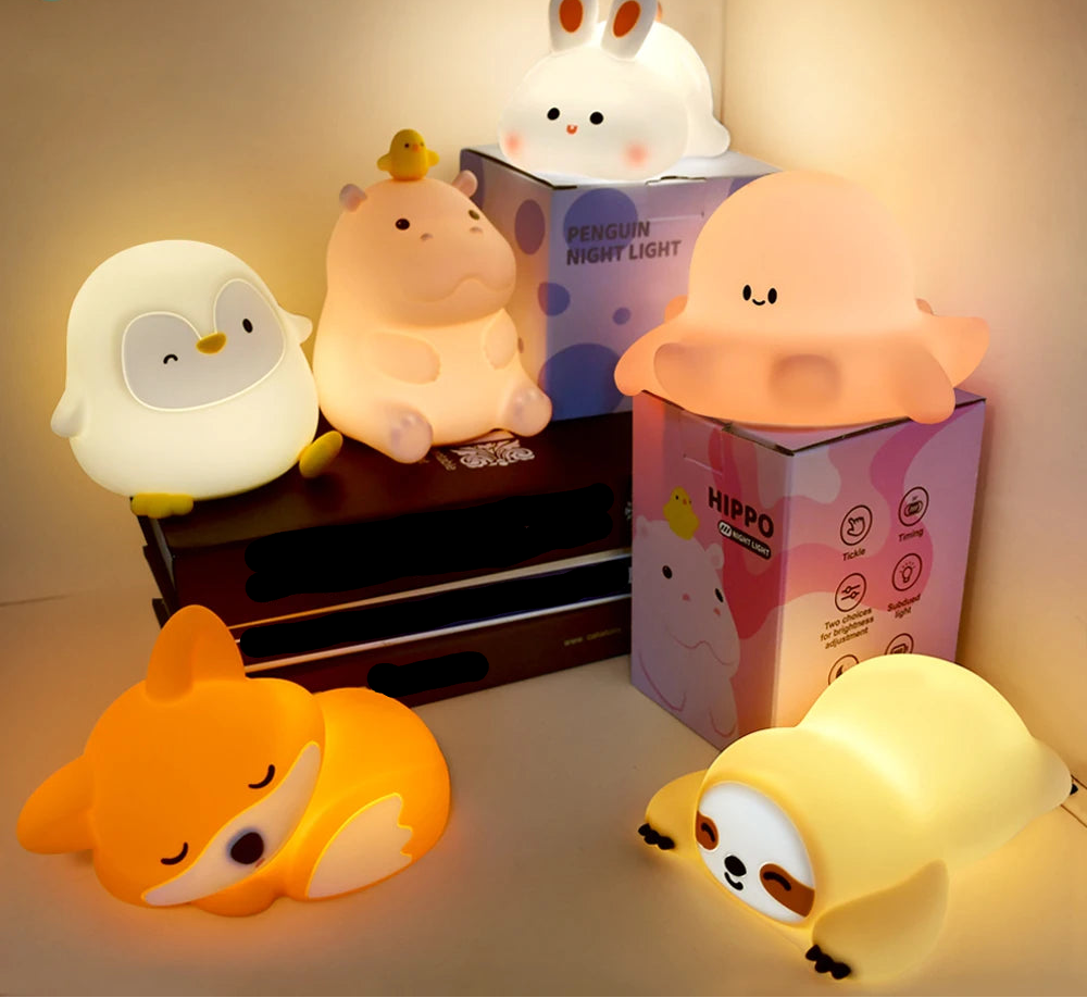 Set of cartoon animal night lights with their packaging on a neutral background